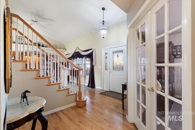 foyer entrance featuring hardwood / wood-style floors and french doors