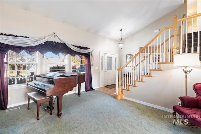 living area with vaulted ceiling and carpet flooring