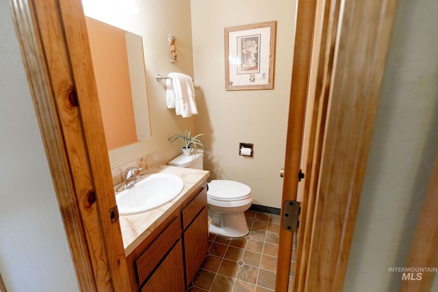 1955 E Parkside Dr, Boise, ID 83712 - bathroom featuring vanity, toilet, and tile patterned floors