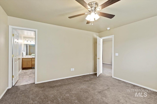 unfurnished bedroom featuring carpet and baseboards