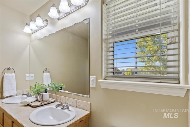bathroom featuring double vanity