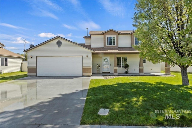 view of front of home featuring a garage, concrete driveway, and a front lawn