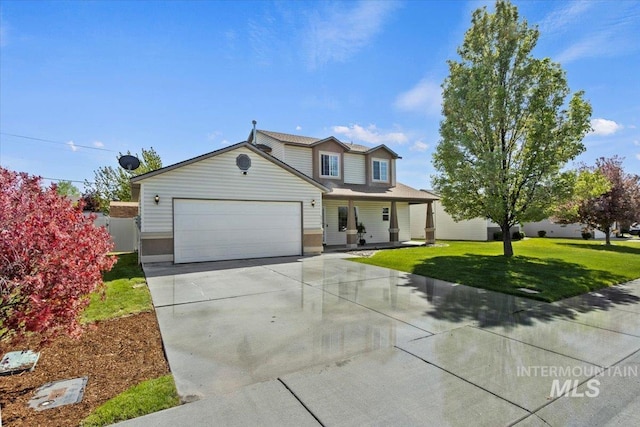 traditional-style house with a front lawn, concrete driveway, a garage, and a porch
