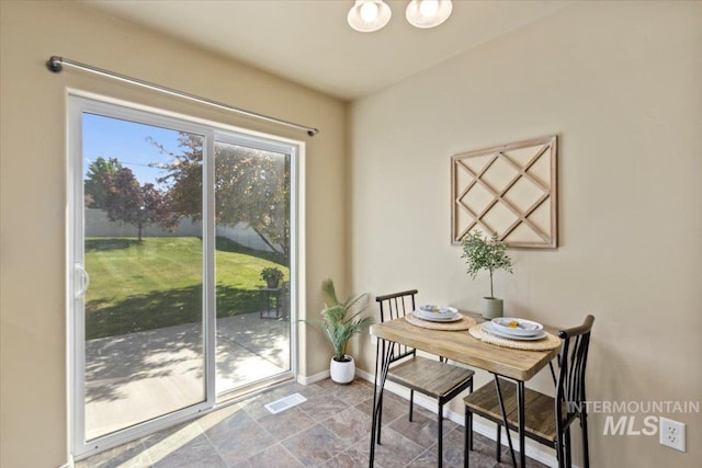 dining space featuring baseboards