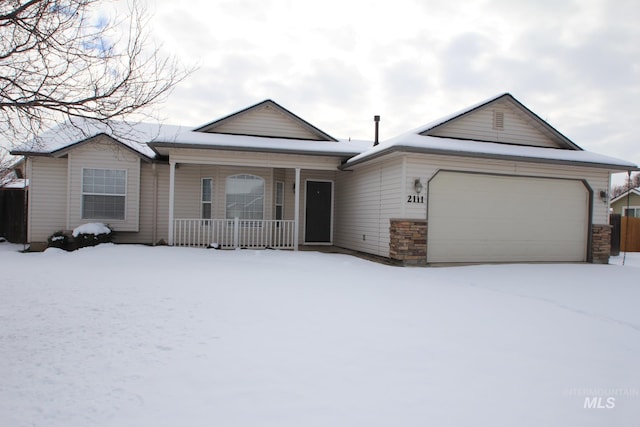 ranch-style house with a garage and covered porch