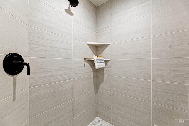 full bathroom with a tile shower