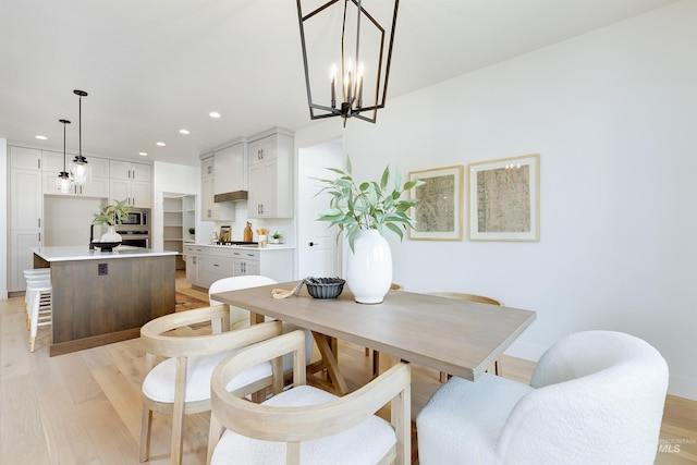 dining room featuring recessed lighting and light wood-type flooring