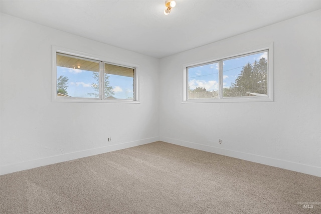 1006 S B St, Rupert, ID 83350 - empty room with light carpet and baseboards