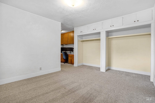 1006 S B St, Rupert, ID 83350 - unfurnished living room featuring an office area, light colored carpet, a textured ceiling, and baseboards