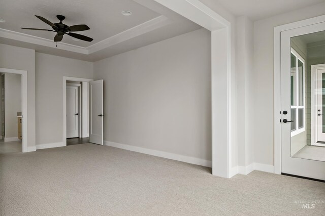 4364 N Madden Way, Meridian, ID 83646 - unfurnished bedroom with a tray ceiling, baseboards, and carpet