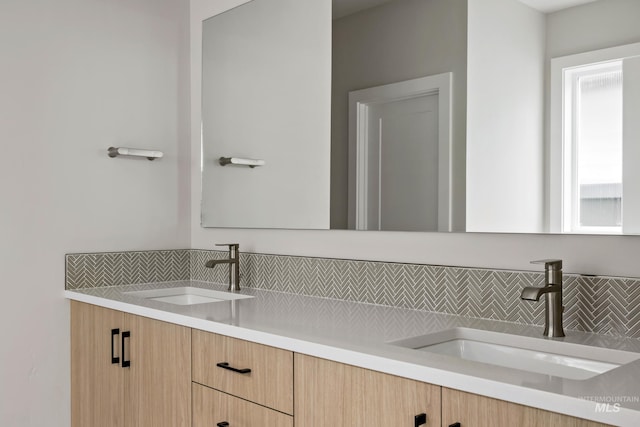 4364 N Madden Way, Meridian, ID 83646 - bathroom featuring double vanity, a sink, and decorative backsplash
