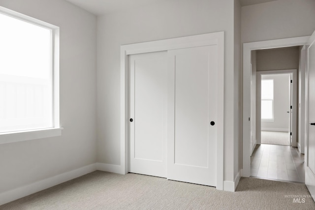 4364 N Madden Way, Meridian, ID 83646 - unfurnished bedroom featuring a closet, baseboards, and carpet floors