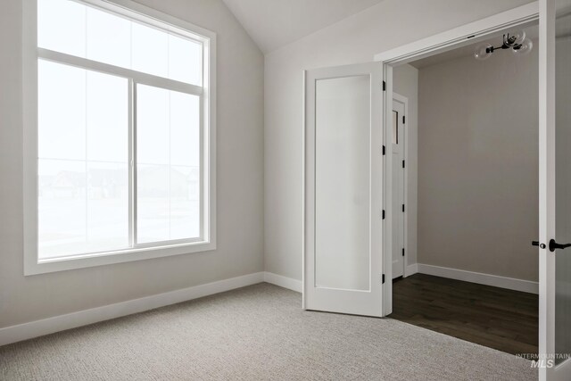 4364 N Madden Way, Meridian, ID 83646 - unfurnished bedroom with carpet, baseboards, and lofted ceiling