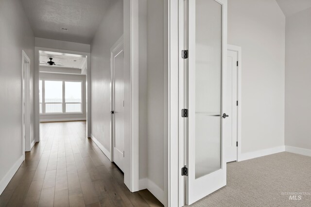 4364 N Madden Way, Meridian, ID 83646 - hall with dark wood-style flooring and baseboards