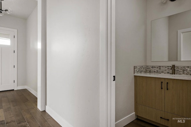 4364 N Madden Way, Meridian, ID 83646 - interior space with vanity, baseboards, wood finished floors, and tasteful backsplash