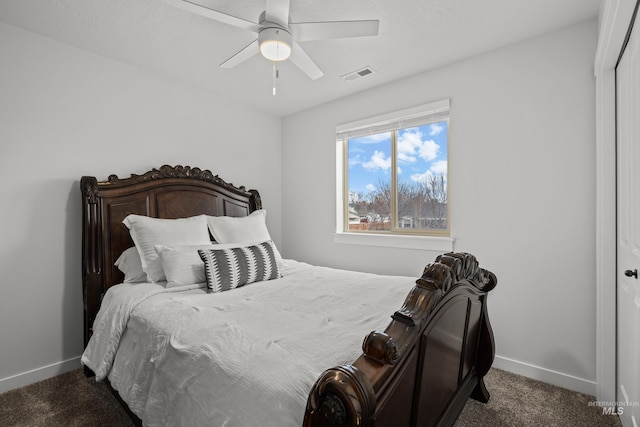 bedroom with visible vents, a ceiling fan, baseboards, and carpet floors