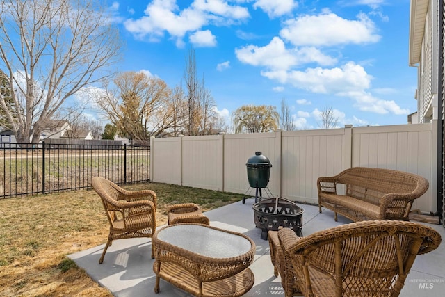 view of patio / terrace featuring a fenced backyard and an outdoor fire pit