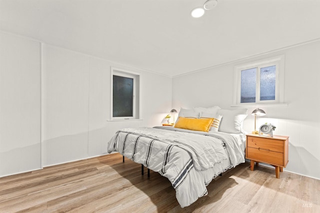 bedroom with light hardwood / wood-style floors