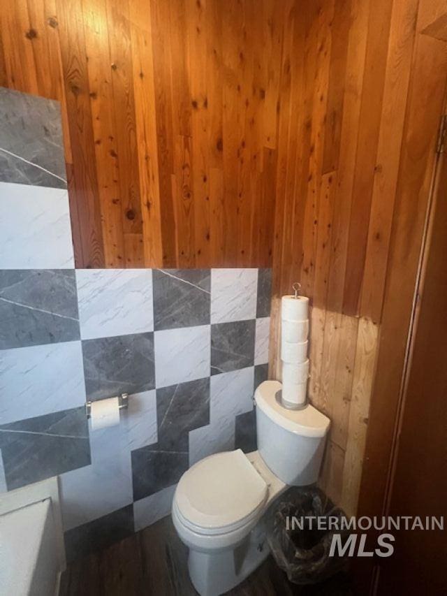 2070 Woodland Rd, Kamiah, ID 83536 - bathroom with wooden walls and toilet