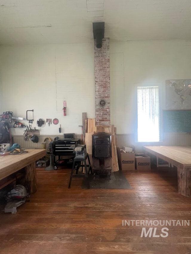 2070 Woodland Rd, Kamiah, ID 83536 - misc room with wood finished floors and a wood stove