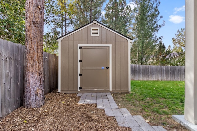 view of shed with a fenced backyard