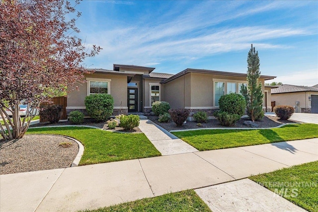 prairie-style house featuring a front yard