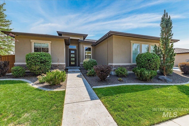 prairie-style house featuring a front yard