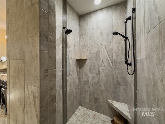 bathroom with a tile shower