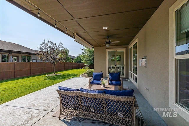 view of patio with ceiling fan and outdoor lounge area