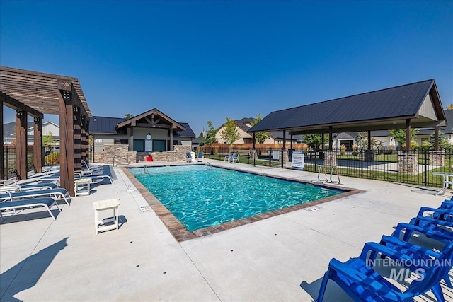 view of swimming pool with a patio