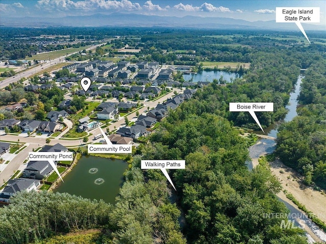 aerial view featuring a water and mountain view