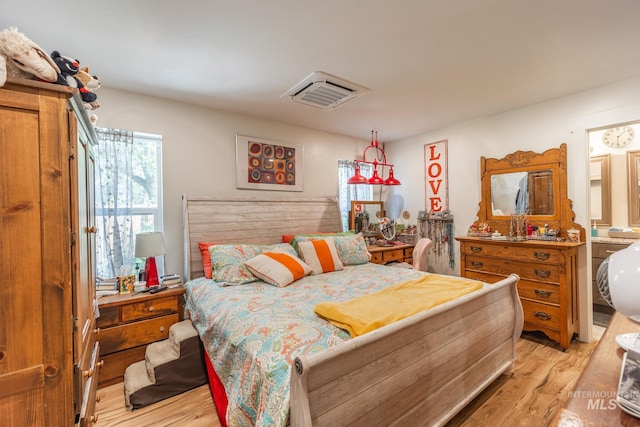 bedroom featuring light hardwood / wood-style floors