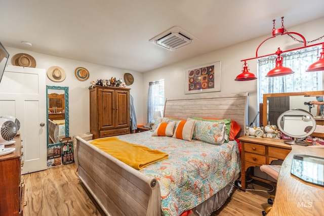 bedroom with light hardwood / wood-style floors