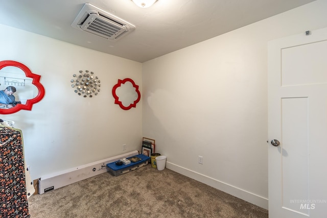 miscellaneous room featuring carpet flooring