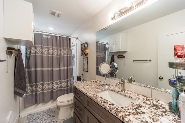 full bathroom with shower / bath combo, vanity, toilet, and tile patterned floors