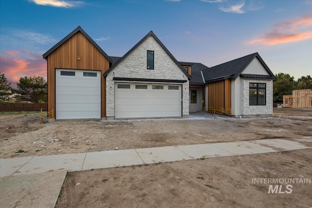 view of front of property featuring board and batten siding and stone siding