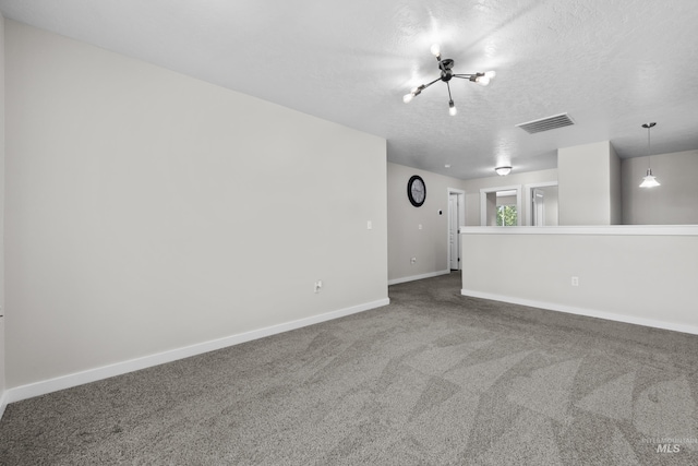 2145 W Quilceda, Kuna, ID 83634 - unfurnished room featuring a textured ceiling, baseboards, and carpet floors