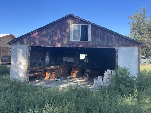 view of home's exterior featuring an outbuilding