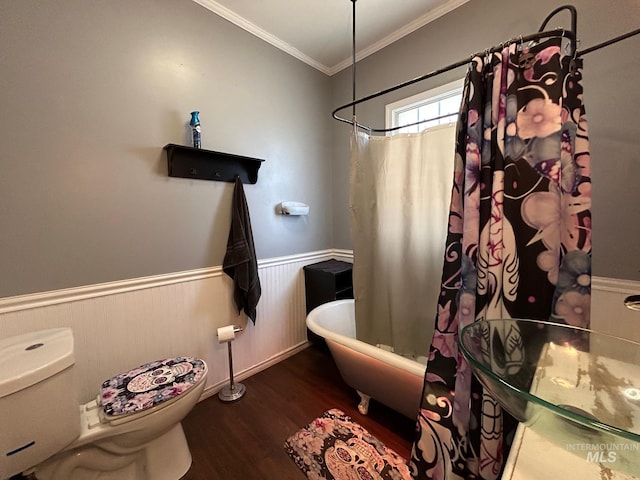 bathroom with shower / bath combination with curtain, toilet, wood-type flooring, and ornamental molding