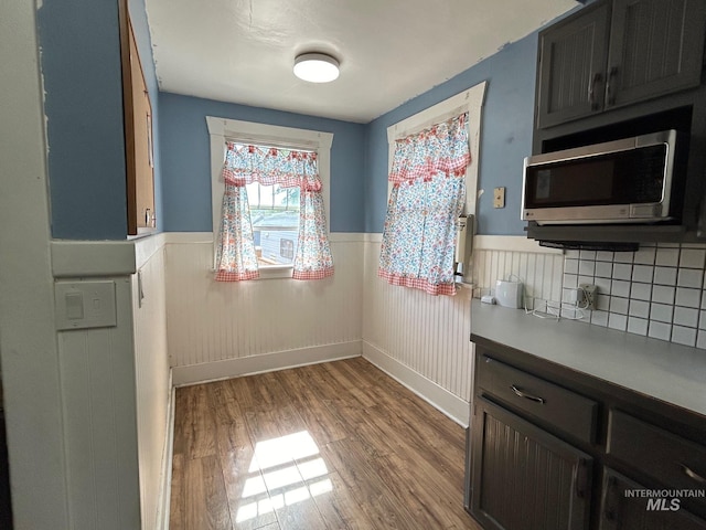 kitchen featuring hardwood / wood-style floors and tasteful backsplash