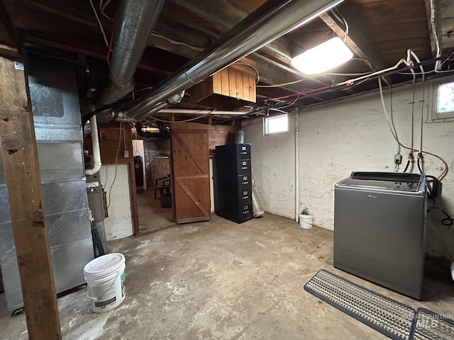 basement featuring washer / clothes dryer and plenty of natural light