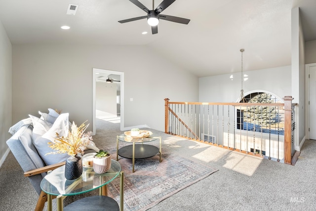 living room with lofted ceiling, carpet flooring, and ceiling fan