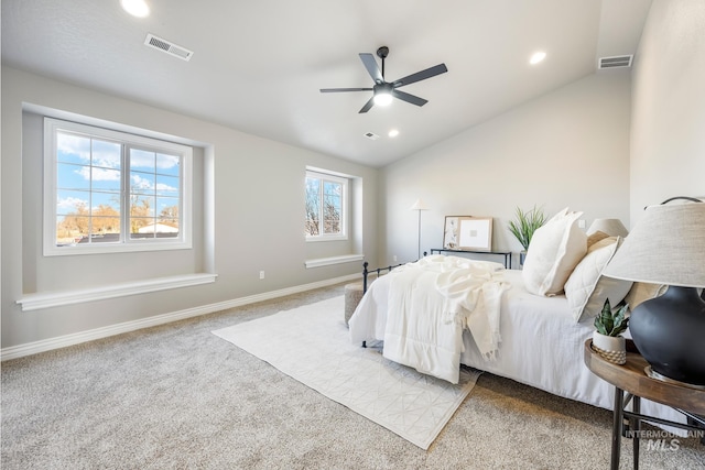 bedroom with ceiling fan, multiple windows, lofted ceiling, and carpet floors