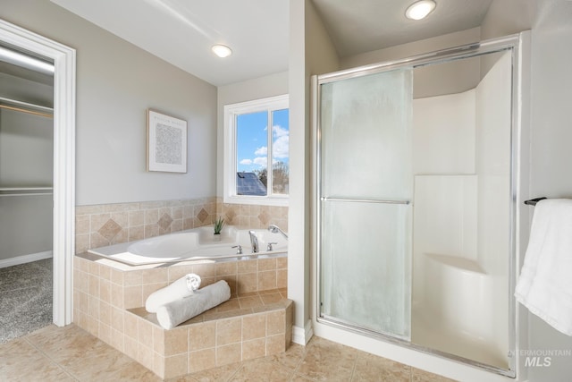 bathroom featuring separate shower and tub and tile patterned floors