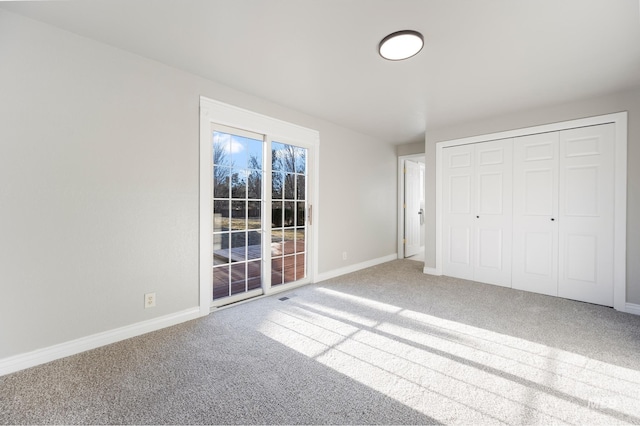 unfurnished bedroom featuring a closet and carpet