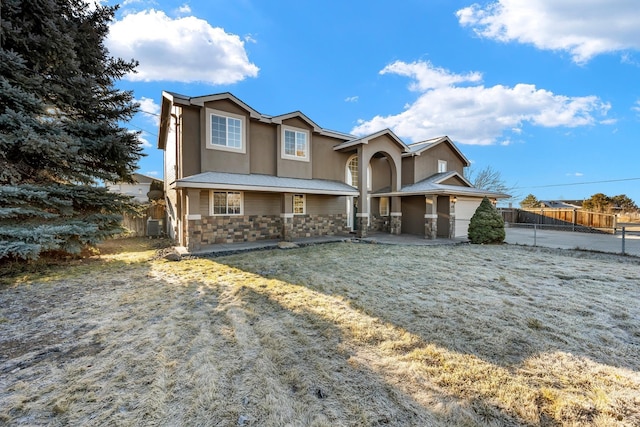 view of front of house featuring a front yard and central AC unit