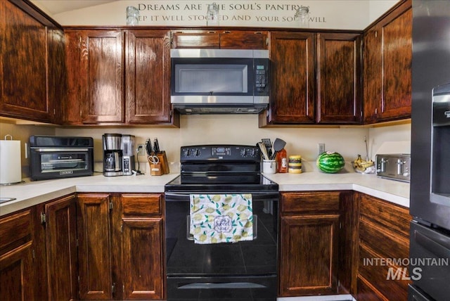 206 Diamond Dr, Kimberly, ID 83341 - kitchen featuring stainless steel microwave, black range with electric stovetop, light countertops, dark brown cabinetry, and vaulted ceiling