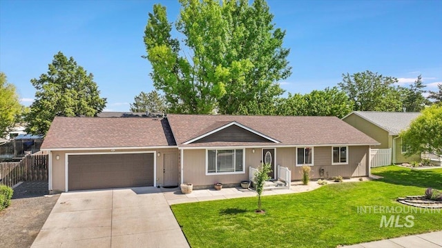 206 Diamond Dr, Kimberly, ID 83341 - ranch-style home with a garage, driveway, and roof with shingles