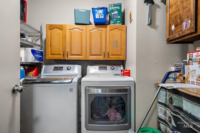 laundry area with cabinets and independent washer and dryer