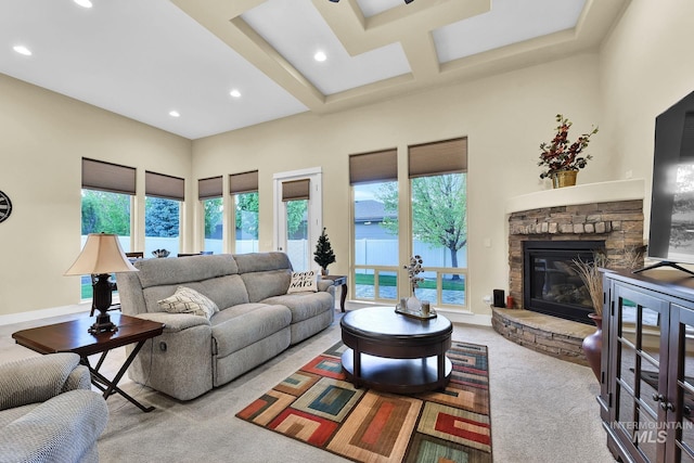 living room featuring carpet flooring, recessed lighting, and a fireplace